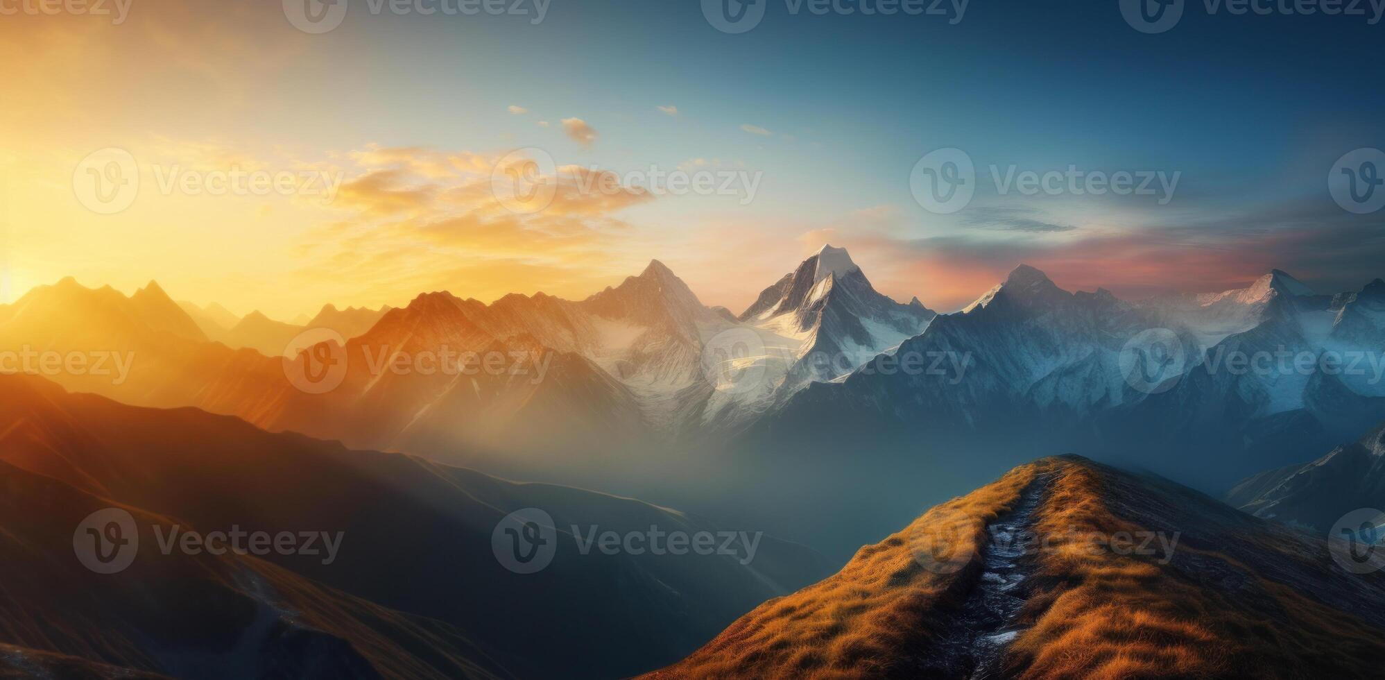 Mountains And Valleys At Golden Hour In Morning. Warm Glow Of Sunrise Over Mountain Peaks. photo