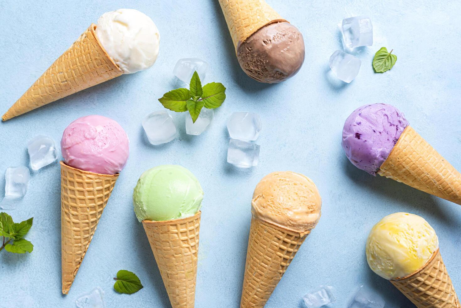 Various ice cream scoops in cones photo