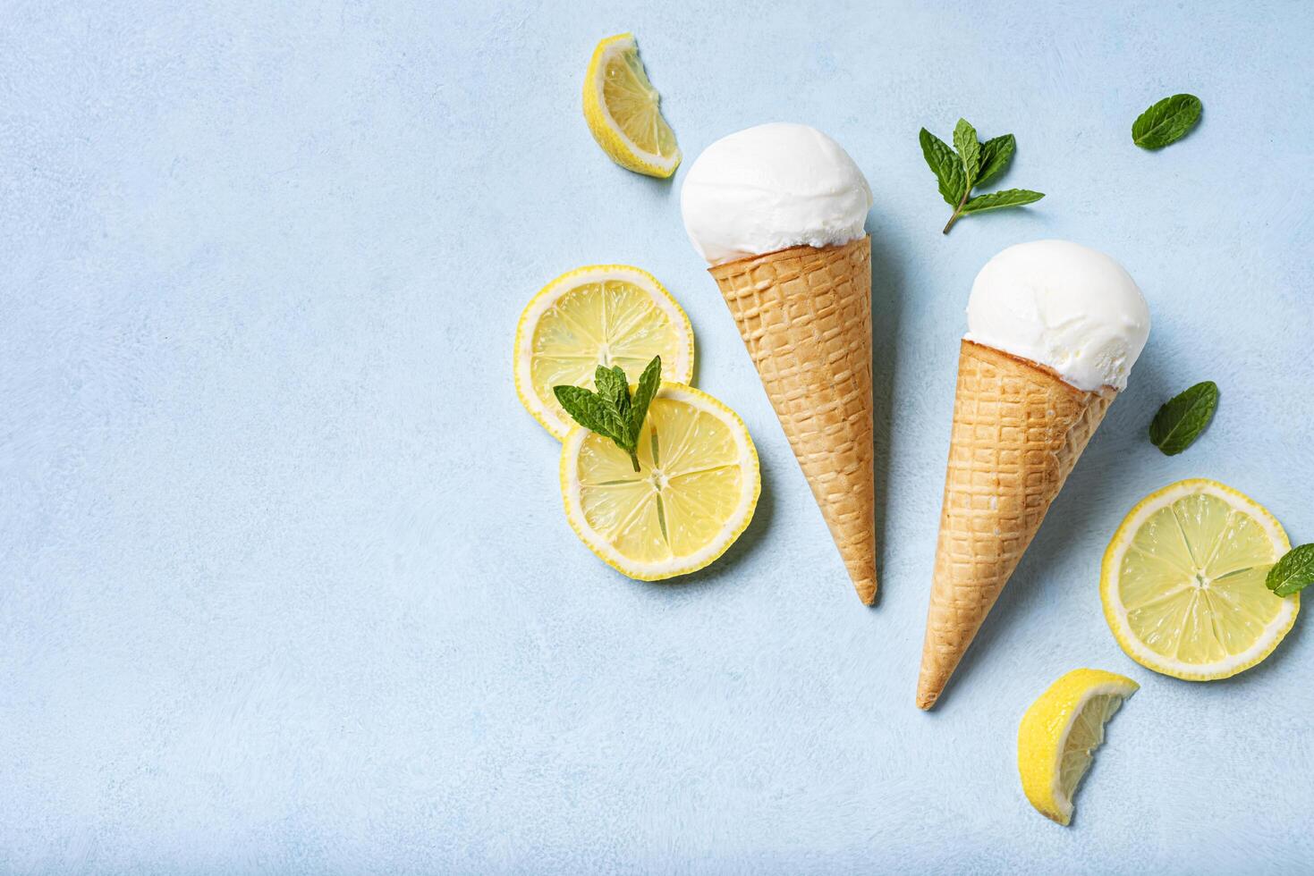 Lemon ice cream and lemon slices photo