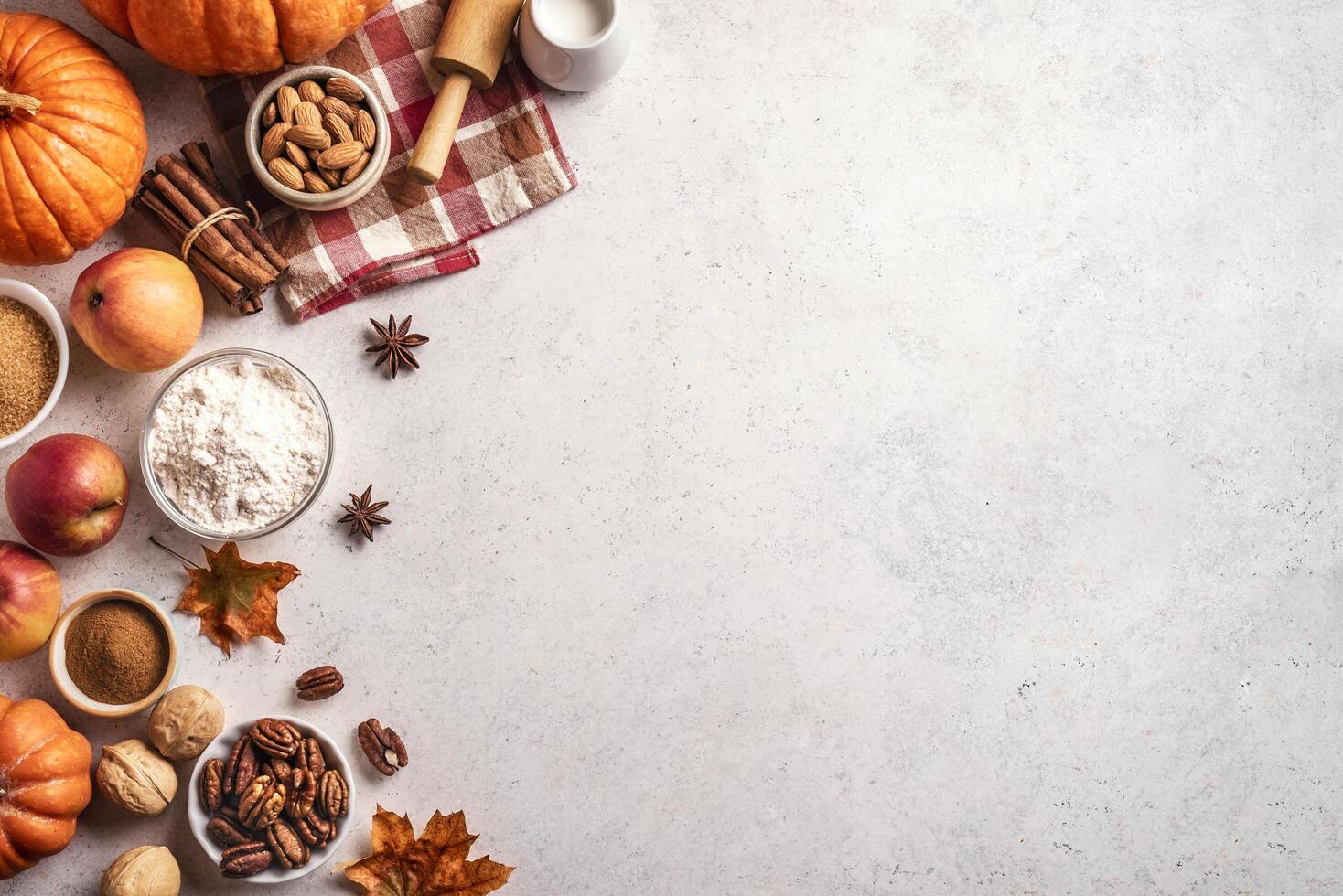 Autumn baking background with pumpkins, apples and nuts photo