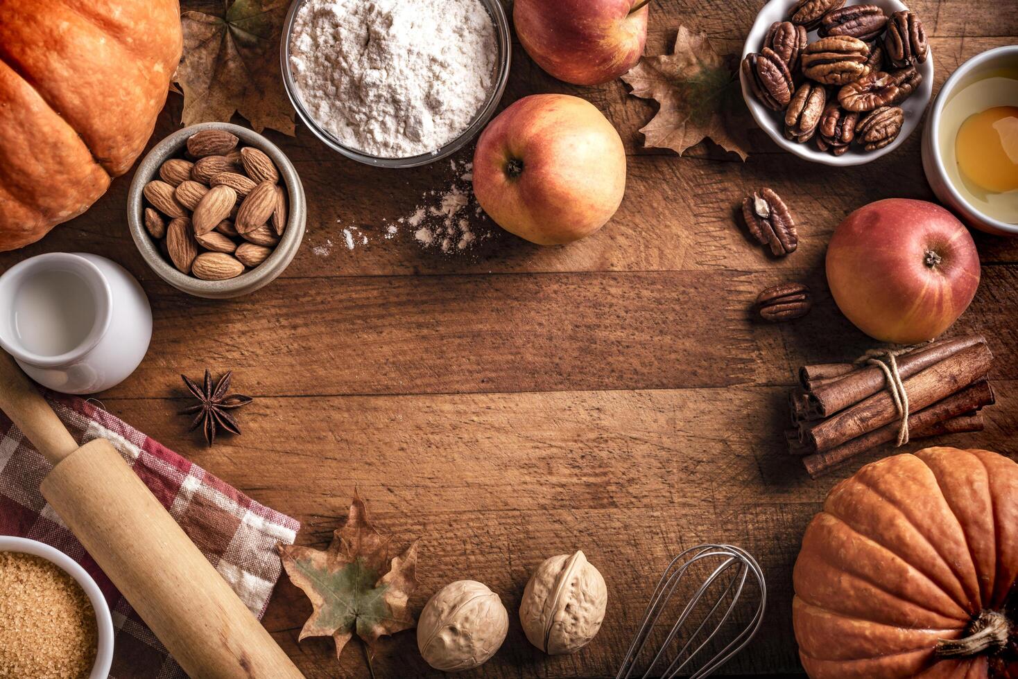 Autumn baking background with pumpkins, apples and nuts photo