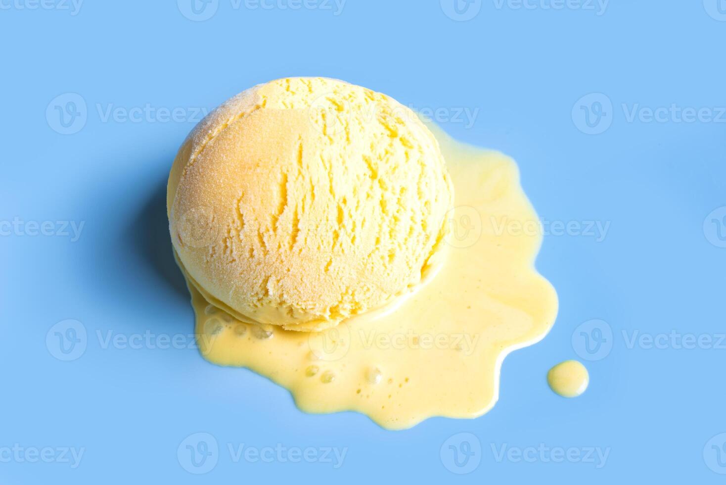 Melting ice cream on blue photo