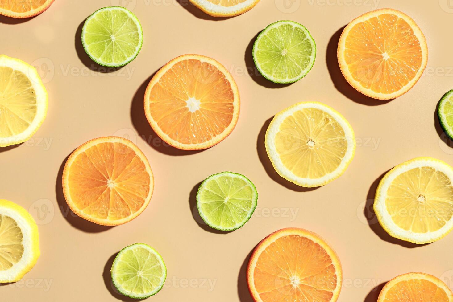Citrus fruit slices pattern, orange, lemon, lime. photo