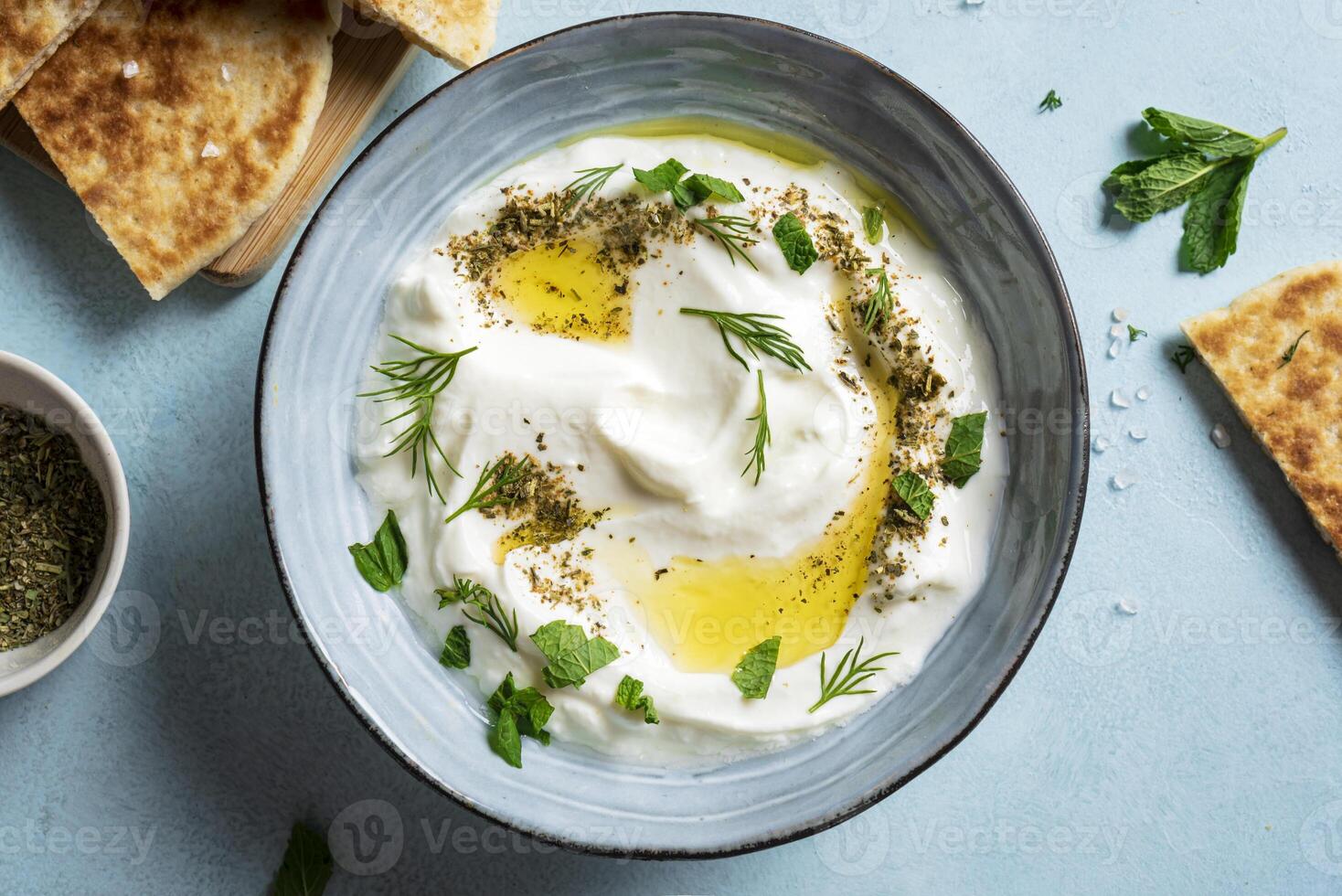 Labneh yogurt cream cheese dip with pita bread photo