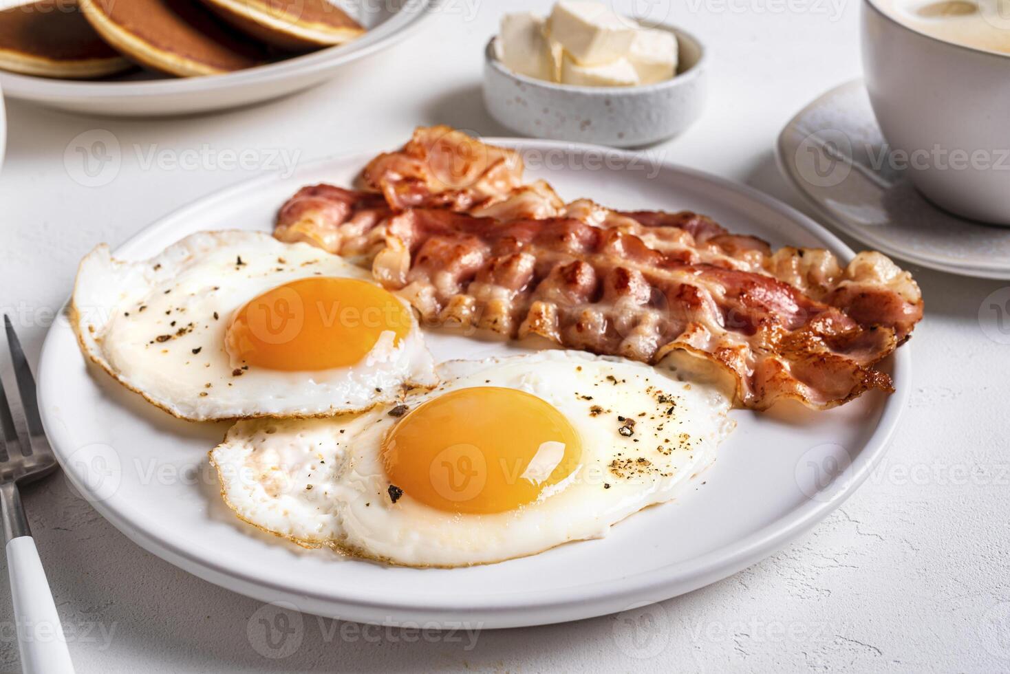 Breakfast with fried eggs and bacon photo