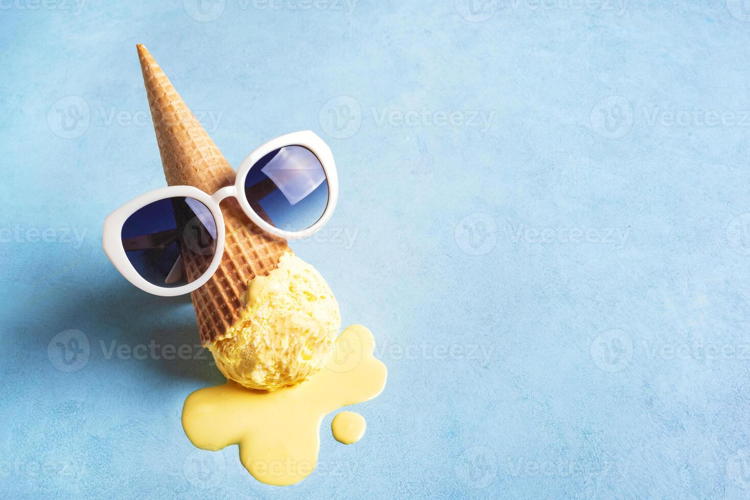 Melting ice cream cone and sunglasses photo