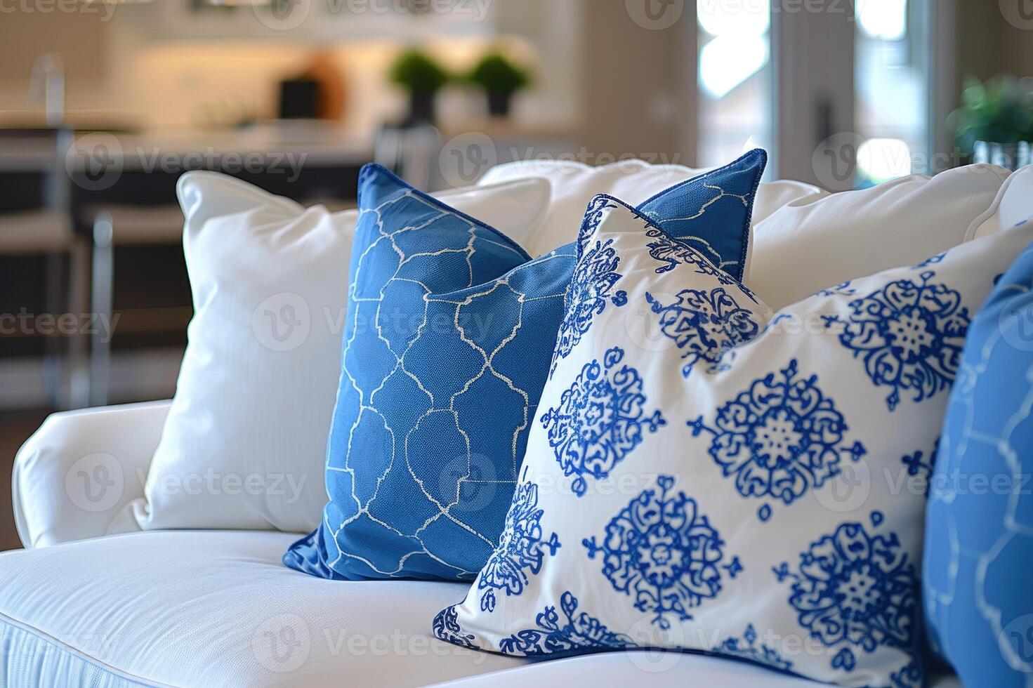 A cozy living room setup featuring a white sofa adorned with pillows photo
