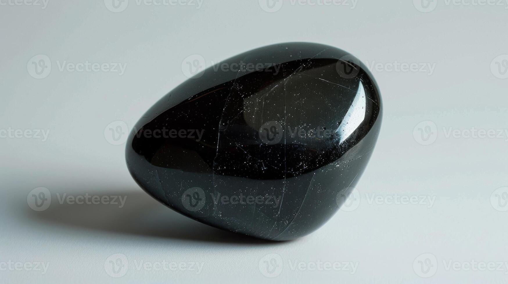 Polished Black Tourmaline Stone CloseUp, Mineral Texture for Healing Crystals, Spirituality, and Meditation photo