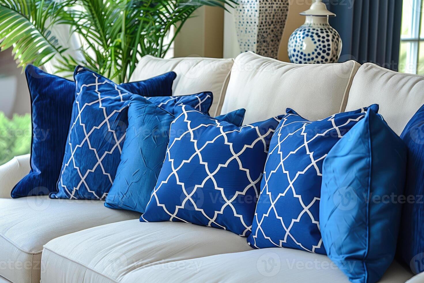 A cozy living room setup featuring a white sofa adorned with pillows photo