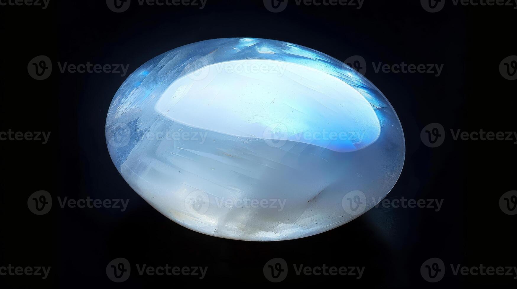 CloseUp Photograph of a Single Polished Moonstone with Iridescent Glow photo