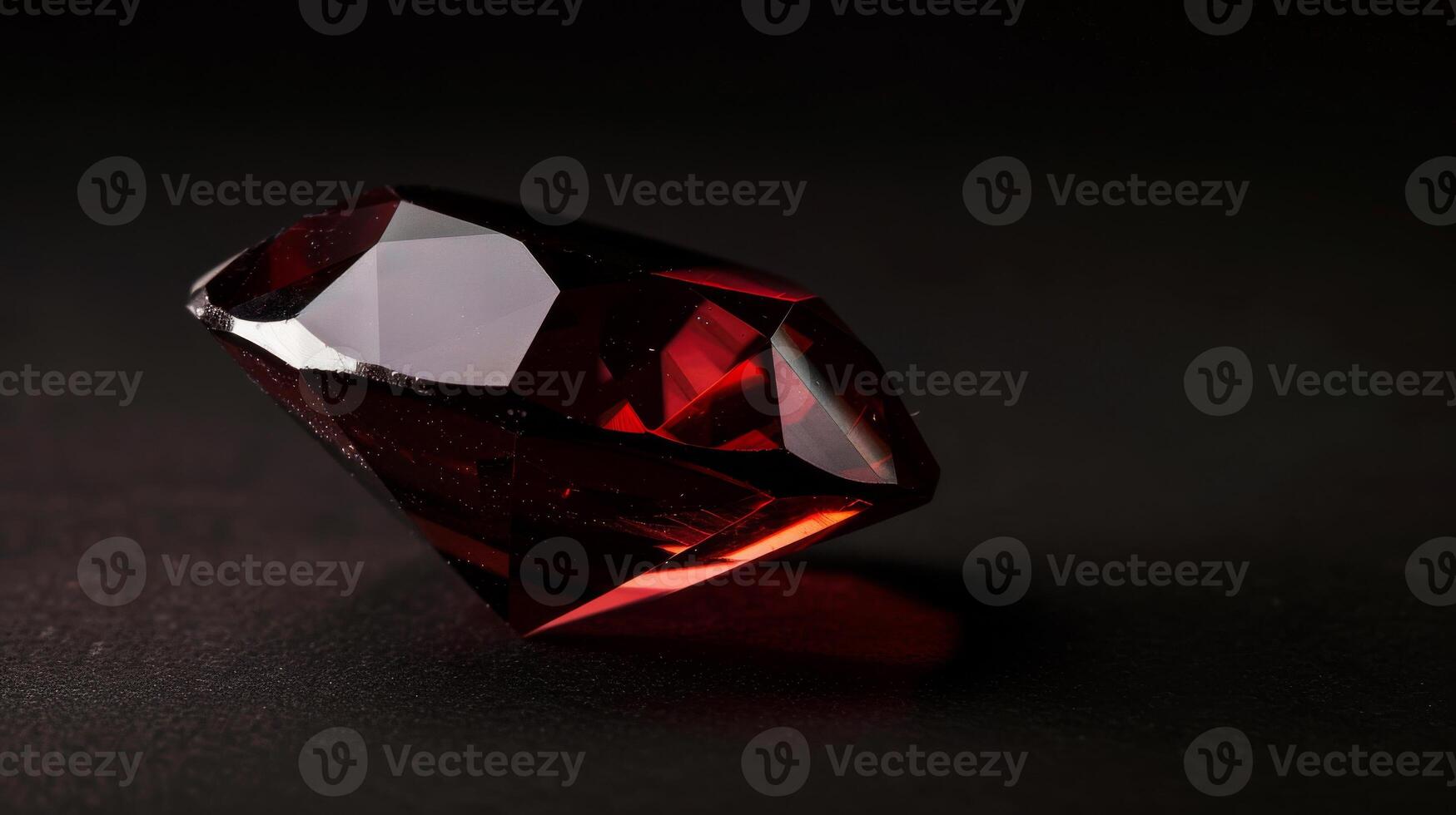 CloseUp of a Polished Garnet Gemstone Against a Dark Background, Perfect for Jewelry Design and Art Prints photo