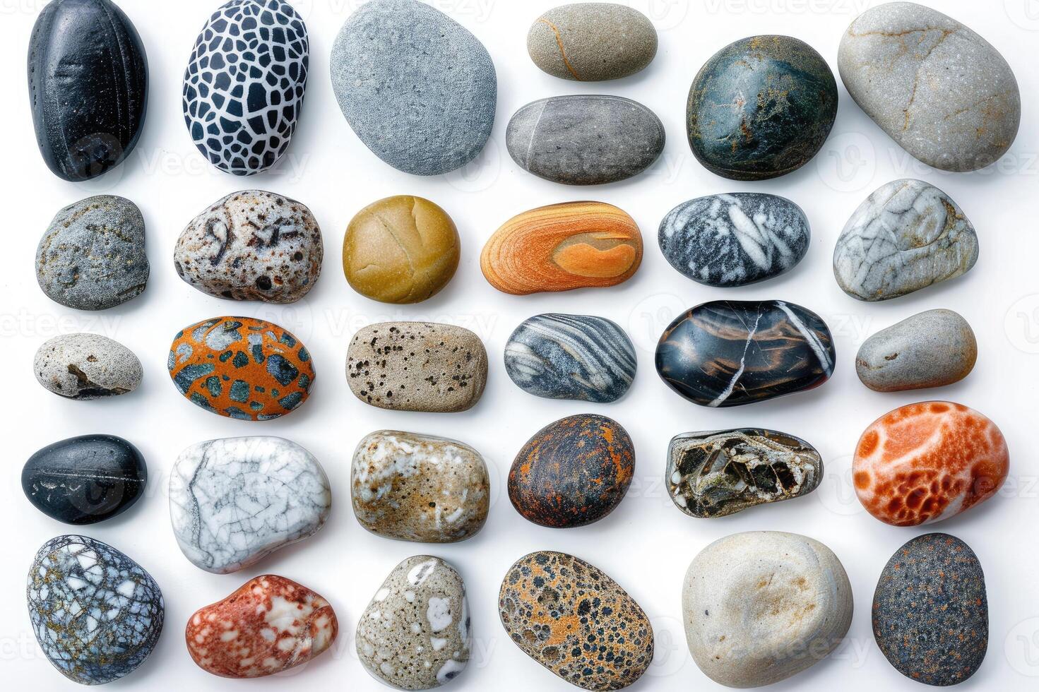Colorful and varied collection of smooth river stones photo