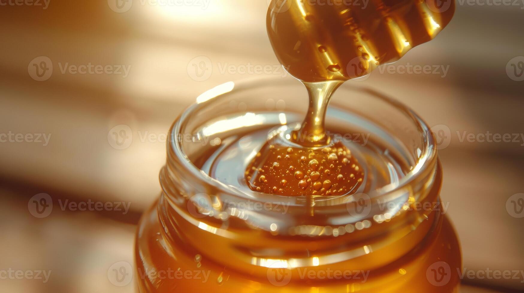 Golden Honey Dripping from Honey Dipper into Open Jar CloseUp Sweet Natural Product for Cooking, Baking, and Health Benefits photo