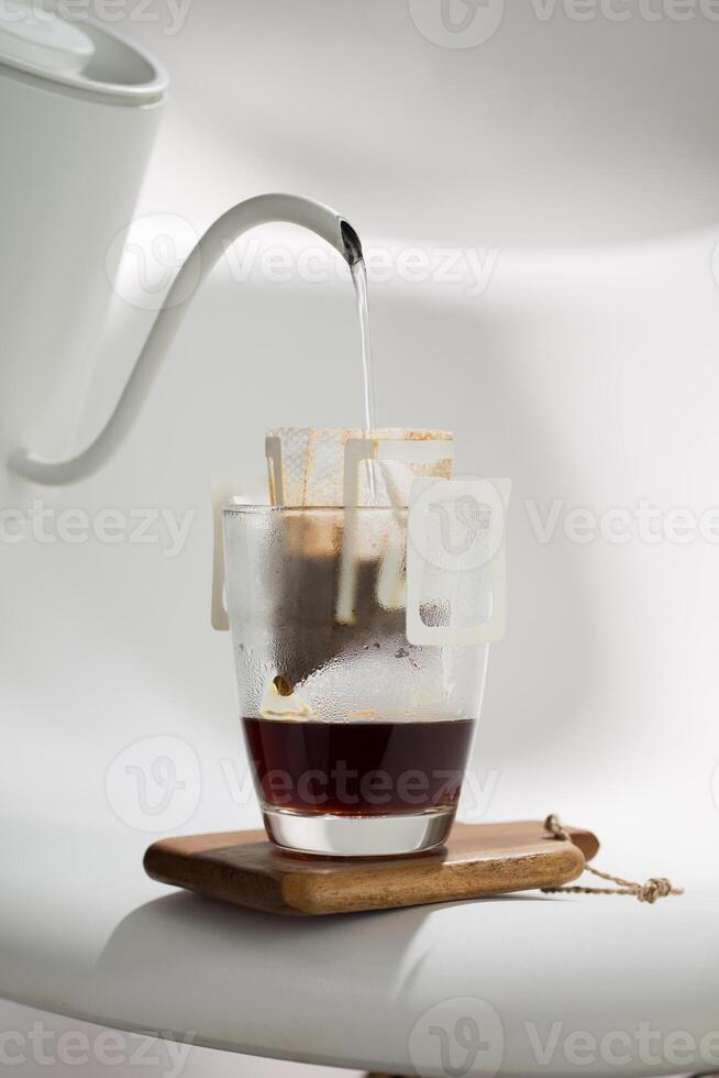 A Drip Bag methodically filters water through Coffee grounds, exemplifying precision in brewing techniques. photo