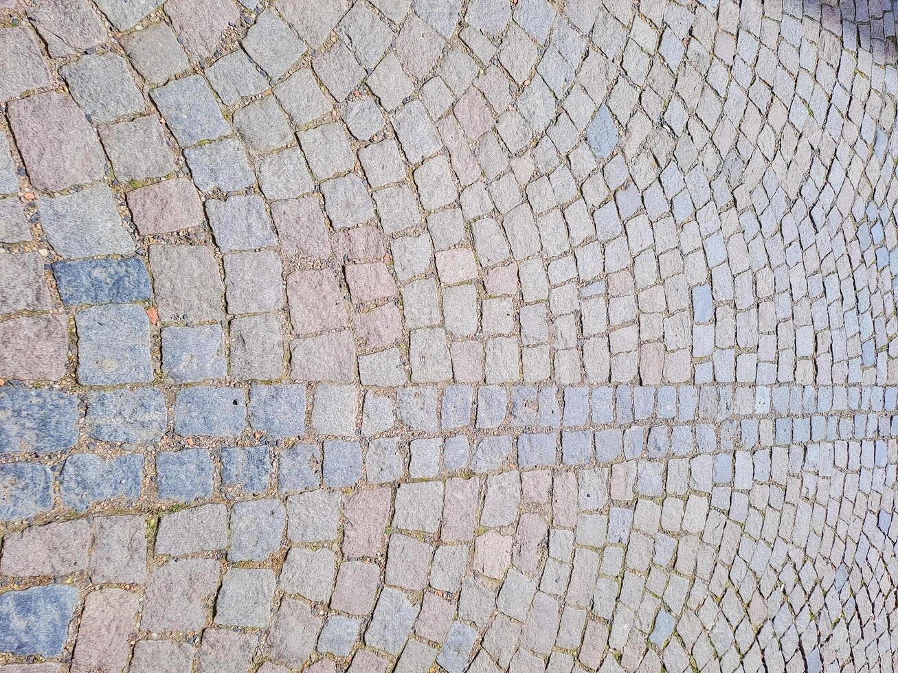 Abstract background. Old cobblestone pavement close-up. photo