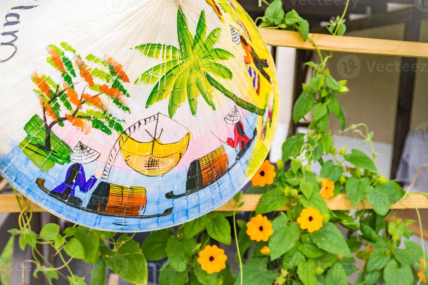 rural summer still life with bamboo hat on yellow flowers background photo
