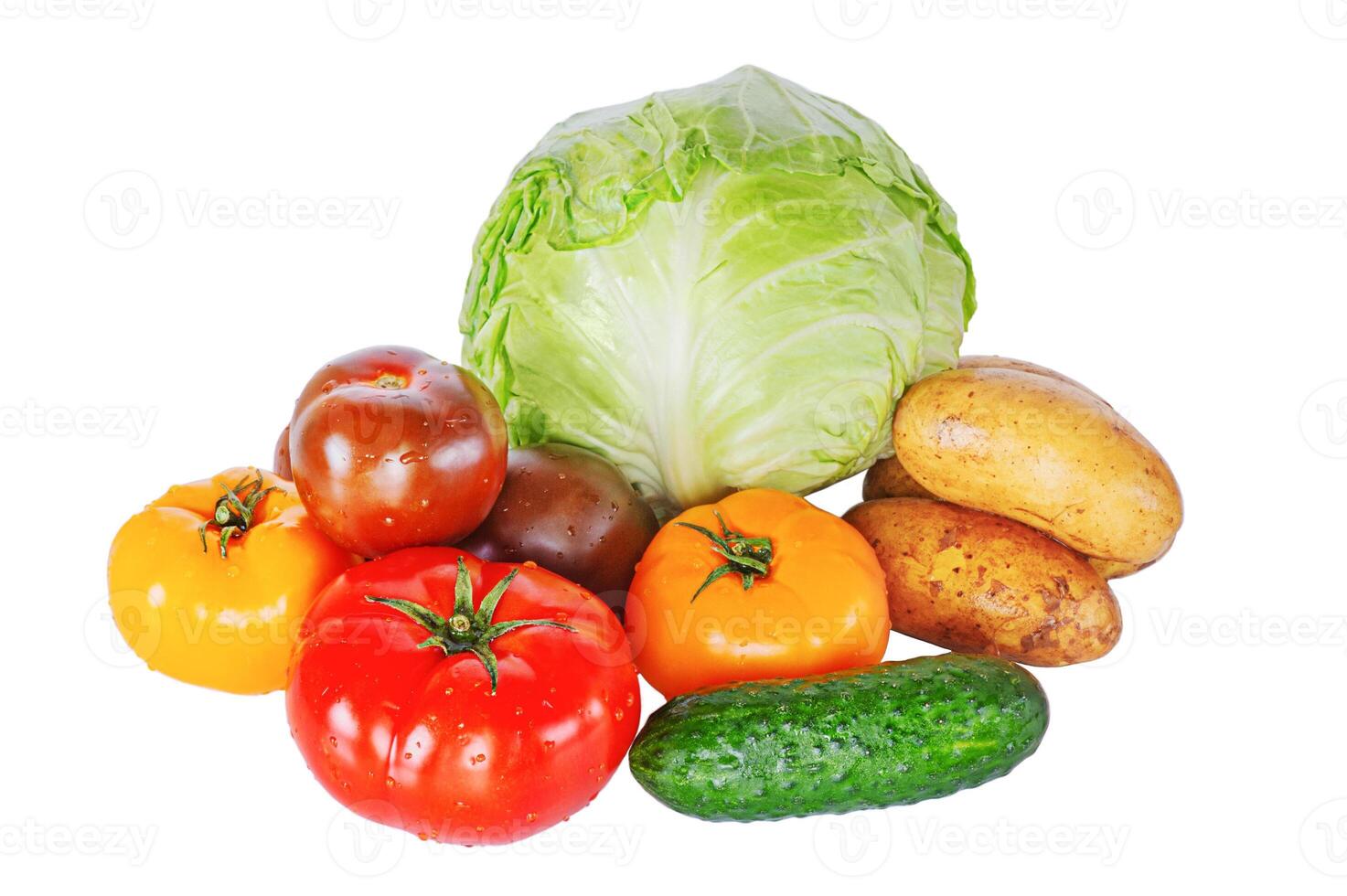 Cabbage, cucumber, colorful tomatoes and potatoes isolated on white. Vegetables, healthy food. Harvesting. photo