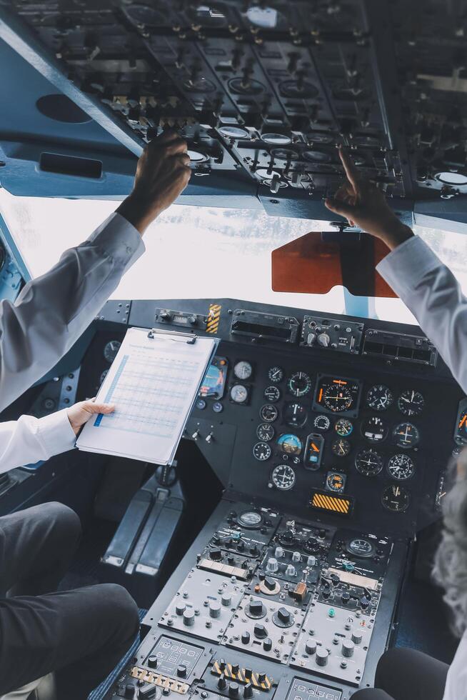Professional pilot woman in uniform has teamwork meeting for success flight in aviation business. Young female captain instructor sitting in office and working or training commercial airline crew. photo