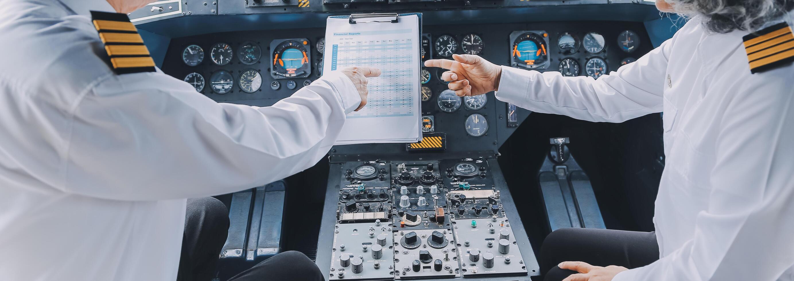 Professional pilot woman in uniform has teamwork meeting for success flight in aviation business. Young female captain instructor sitting in office and working or training commercial airline crew. photo