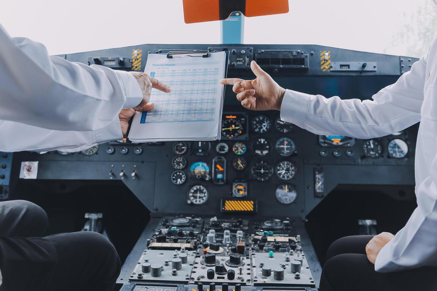 Professional pilot woman in uniform has teamwork meeting for success flight in aviation business. Young female captain instructor sitting in office and working or training commercial airline crew. photo