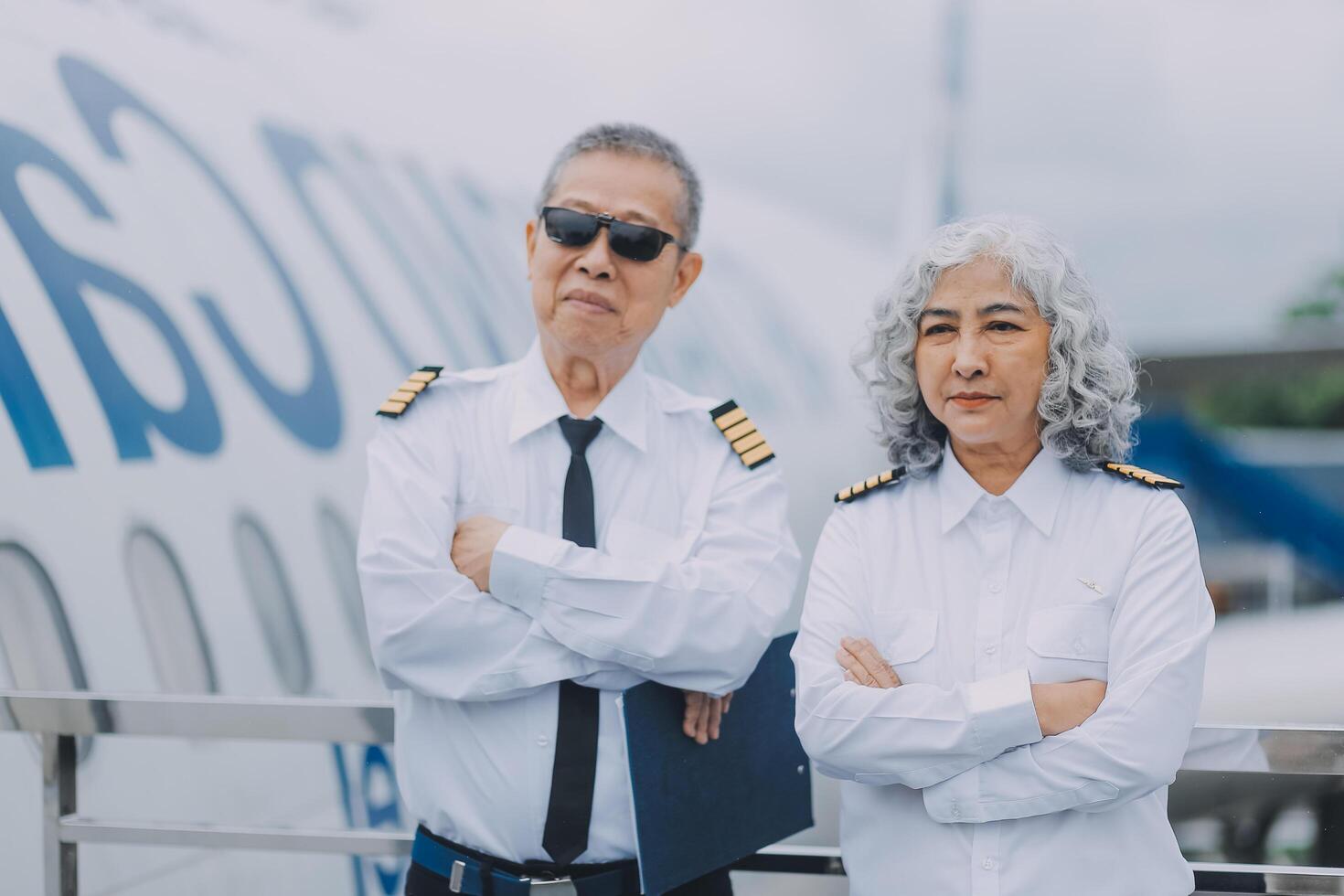 Professional pilot woman in uniform has teamwork meeting for success flight in aviation business. Young female captain instructor sitting in office and working or training commercial airline crew. photo