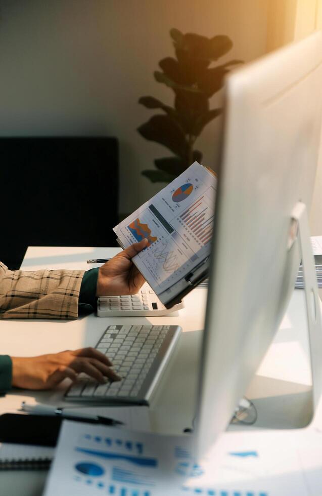 Team of business people working together in the meeting room office, teamwork background charts and graphs banner, double exposure successful teamwork,business planning concept. photo