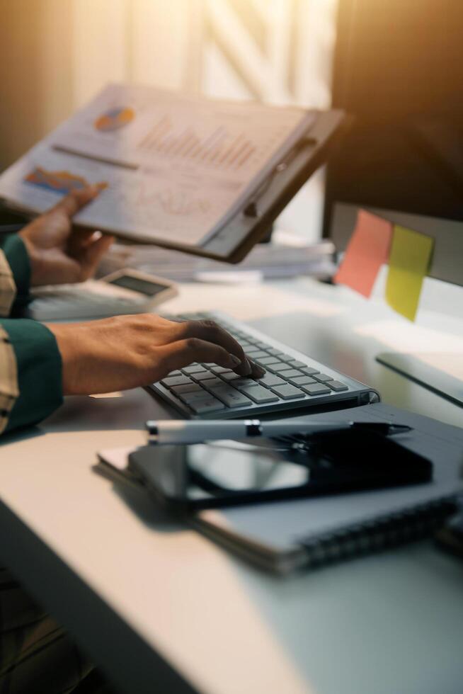 Team of business people working together in the meeting room office, teamwork background charts and graphs banner, double exposure successful teamwork,business planning concept. photo