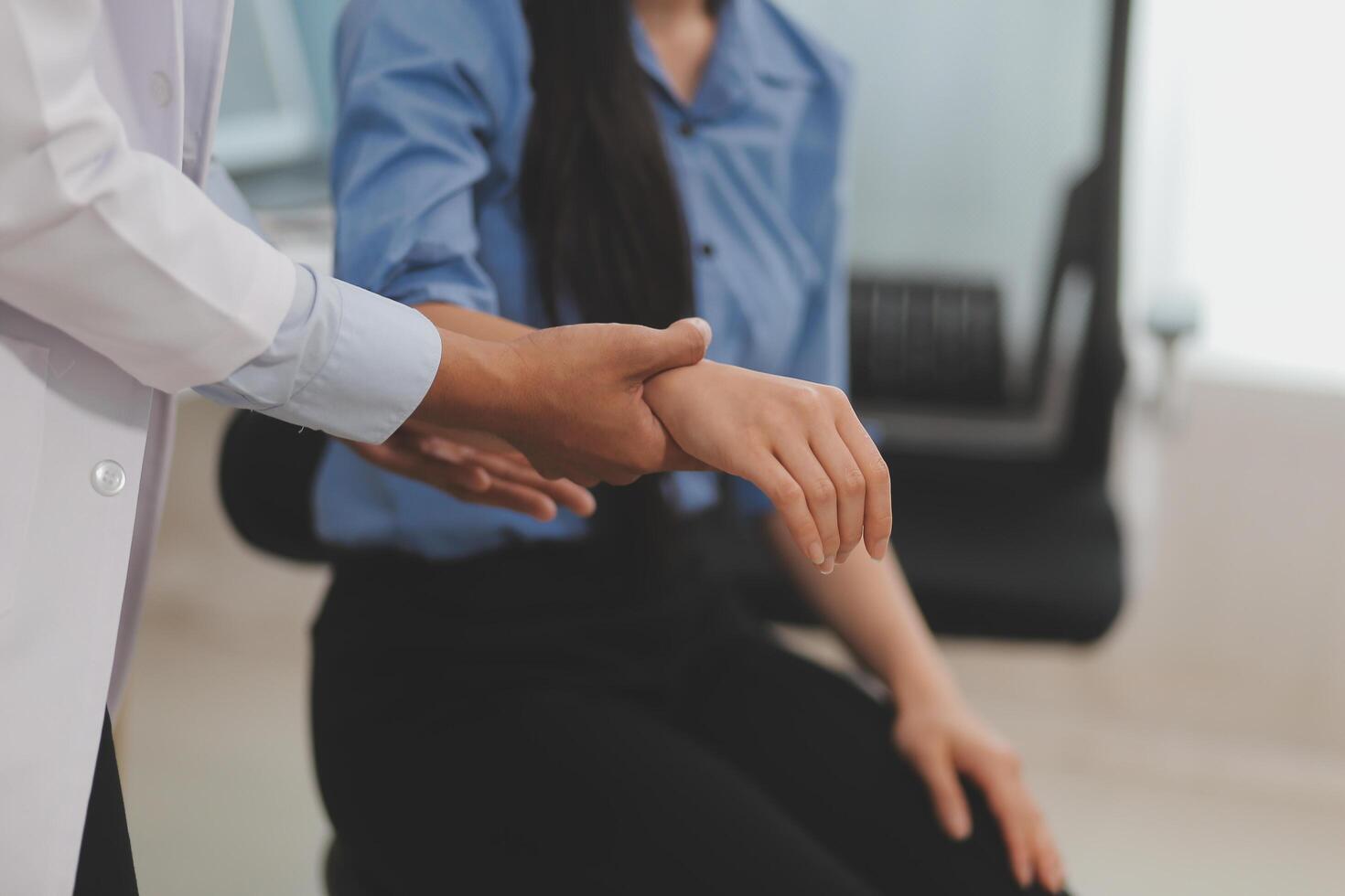 Doctor or Physiotherapist working examining treating injured arm of athlete male patient, stretching and exercise, Doing the Rehabilitation therapy pain in clinic. photo