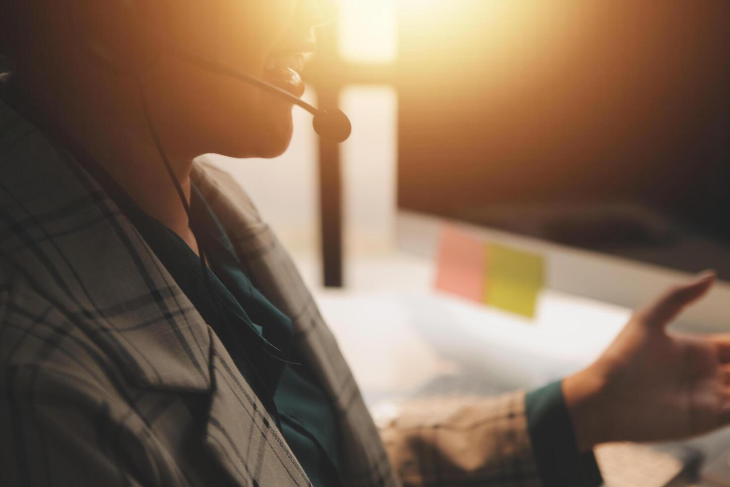 Call center, computer and business with woman in office for customer service, technical support and advice. Technology, contact us and communication with employee operator in help desk agency photo