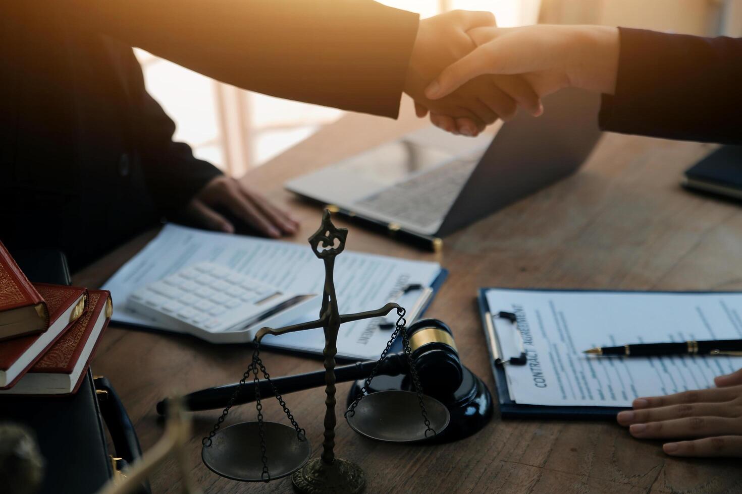 concept of justice and law A male judge in the courtroom on a wooden table and a male counselor or lawyer working in the office. Law, advice and justice concepts. photo