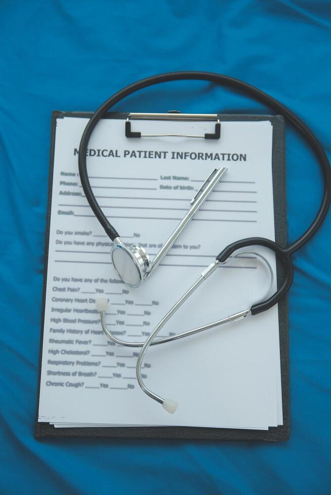 In a hospital setting, the presence of a doctor's physician book and stethoscope carries with it an air of professionalism and dedication to patient care. photo