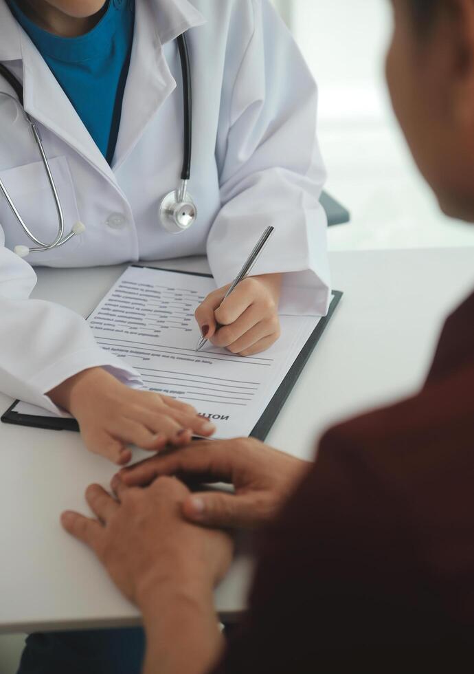 Female doctors shake hands with patients encouraging each other To offer love, concern, and encouragement while checking the patient's health. Concept Health care and Social Security photo
