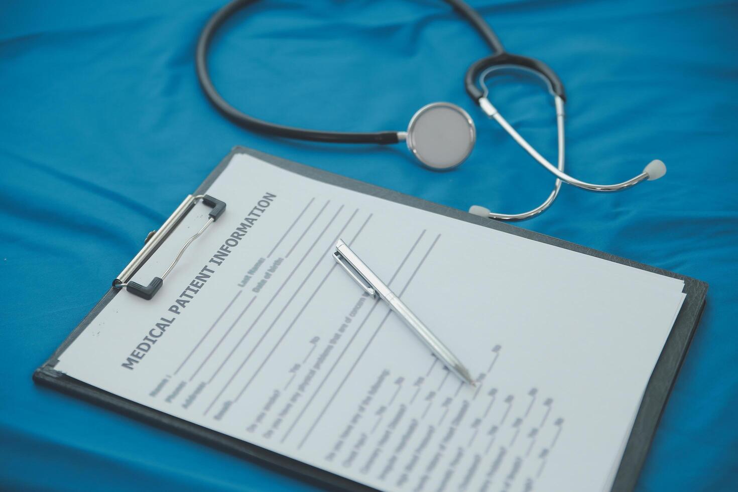 In a hospital setting, the presence of a doctor's physician book and stethoscope carries with it an air of professionalism and dedication to patient care. photo