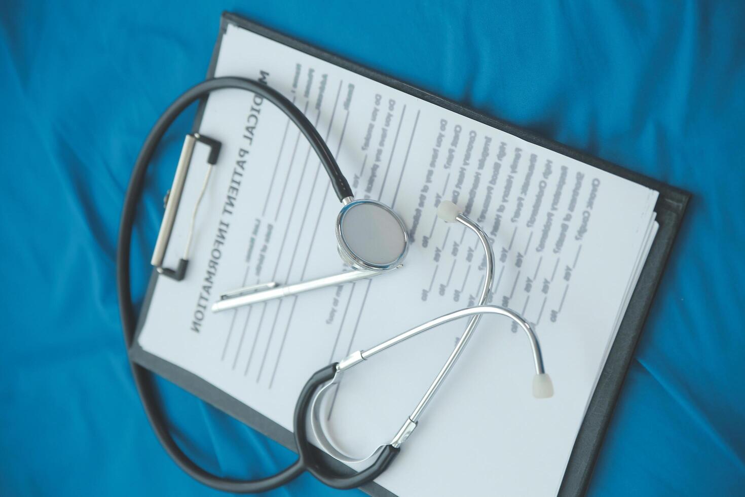 In a hospital setting, the presence of a doctor's physician book and stethoscope carries with it an air of professionalism and dedication to patient care. photo