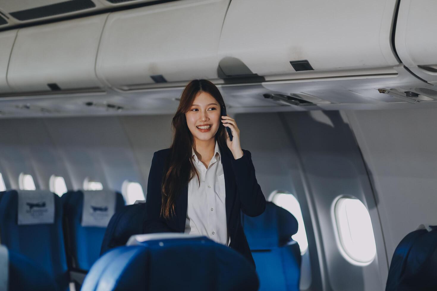 Asian young women passenger walk in airport terminal to boarding gate. Attractive beautiful female tourist friends feeling happy and excited to go travel abroad by airplane for holiday vacation trip. photo