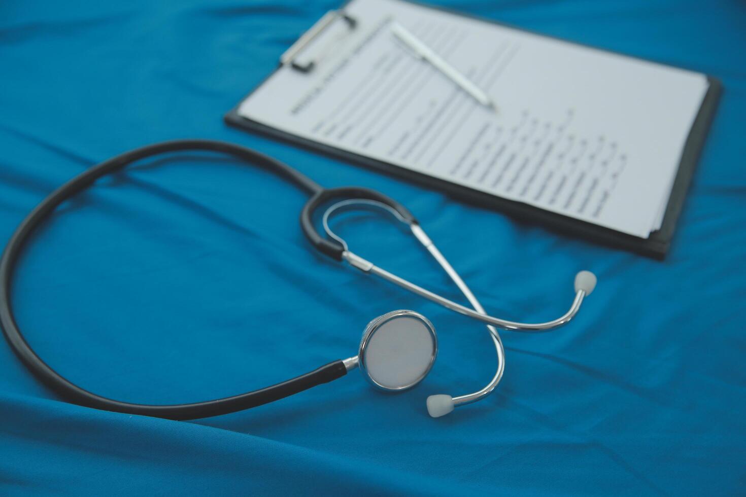In a hospital setting, the presence of a doctor's physician book and stethoscope carries with it an air of professionalism and dedication to patient care. photo