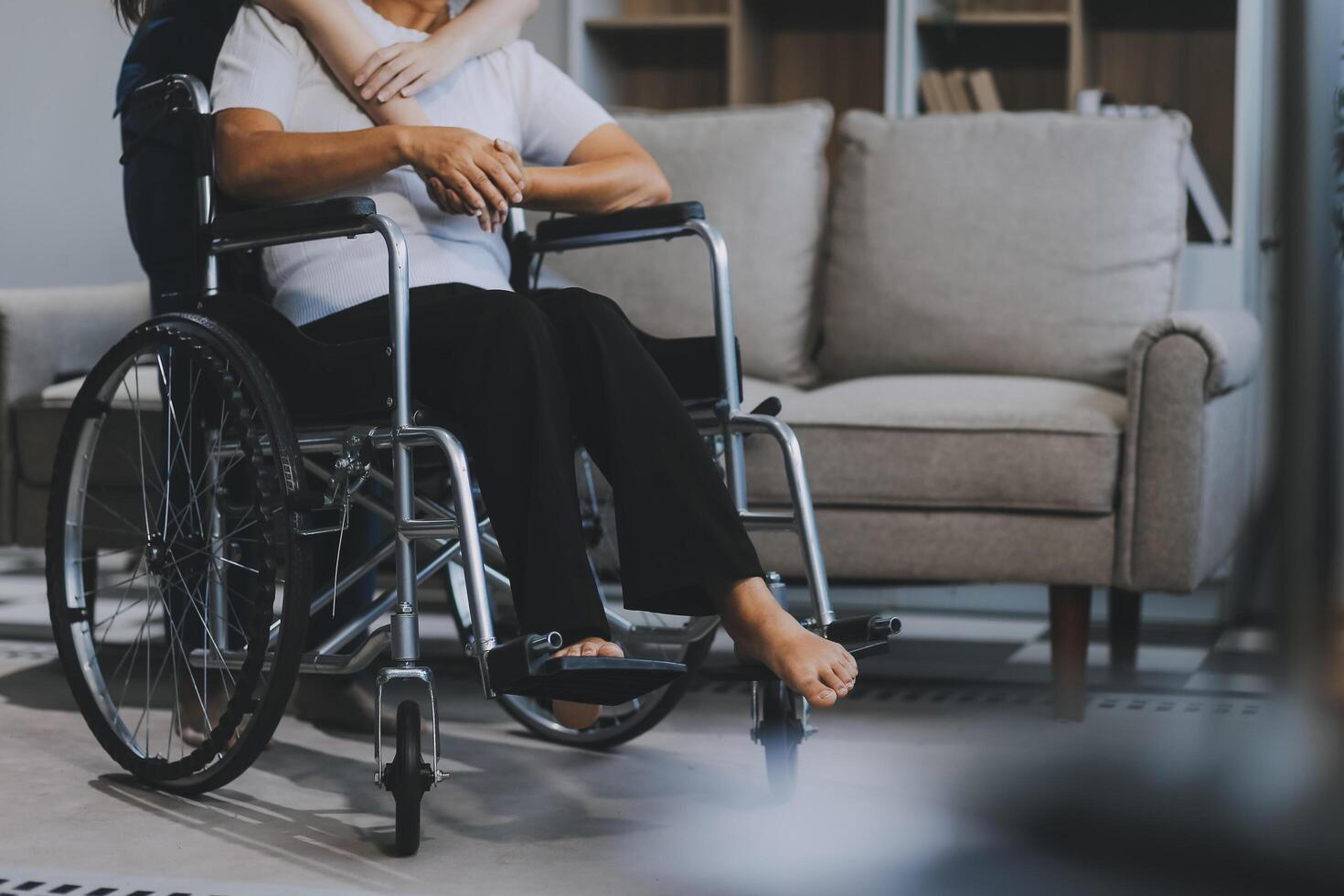 Asian physiotherapist helping elderly woman patient stretching arm during exercise correct with dumbbell in hand during training hand with patient Back problems in garden. Nursing home hospital photo