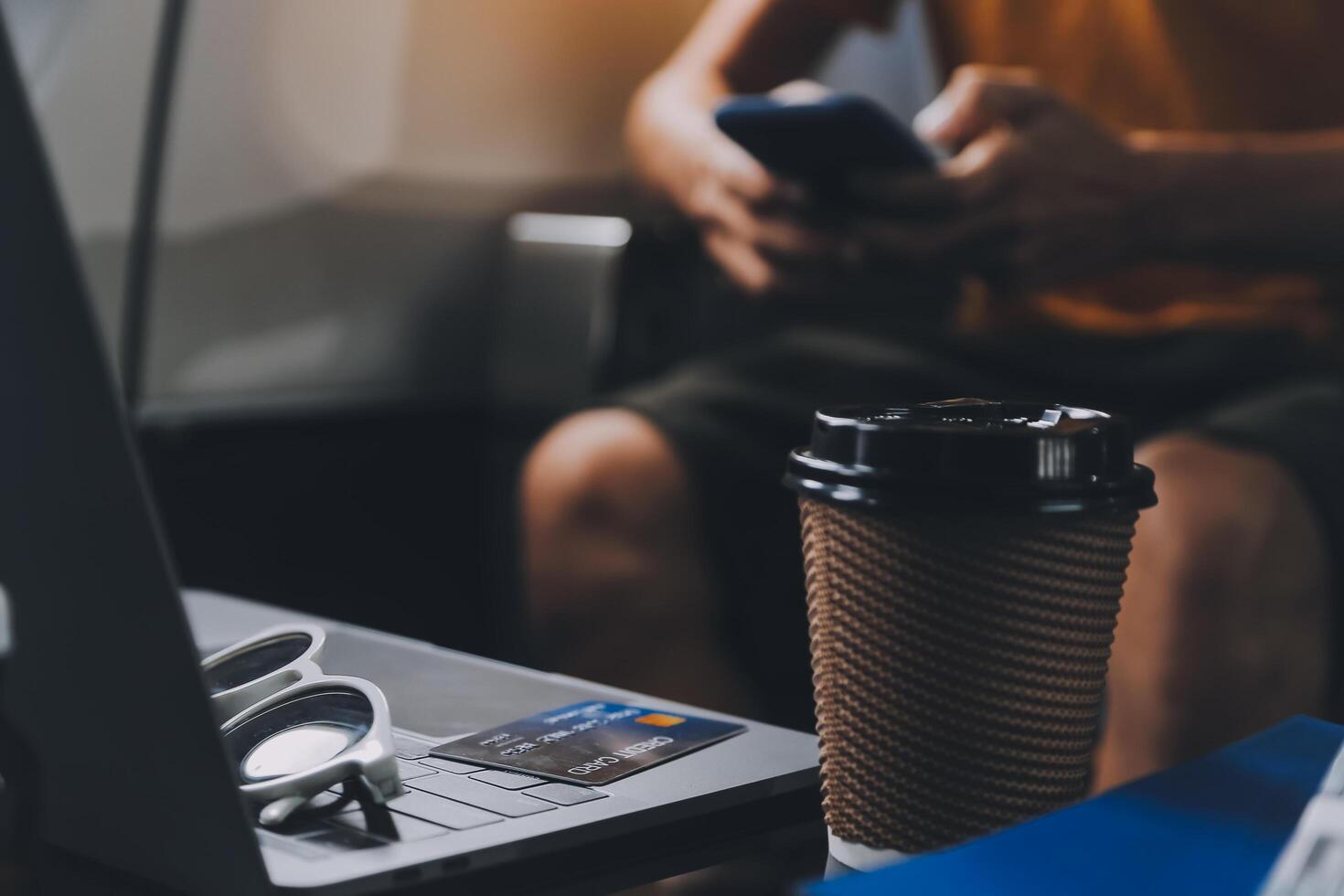 Attractive Asian businesswoman traveling on airplane playing with mobile phone while sitting in cabin. photo