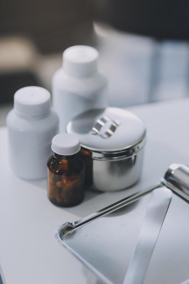 Health care billing statement with stethoscope, bottle of medicine for doctor's work in medical center stone background. photo