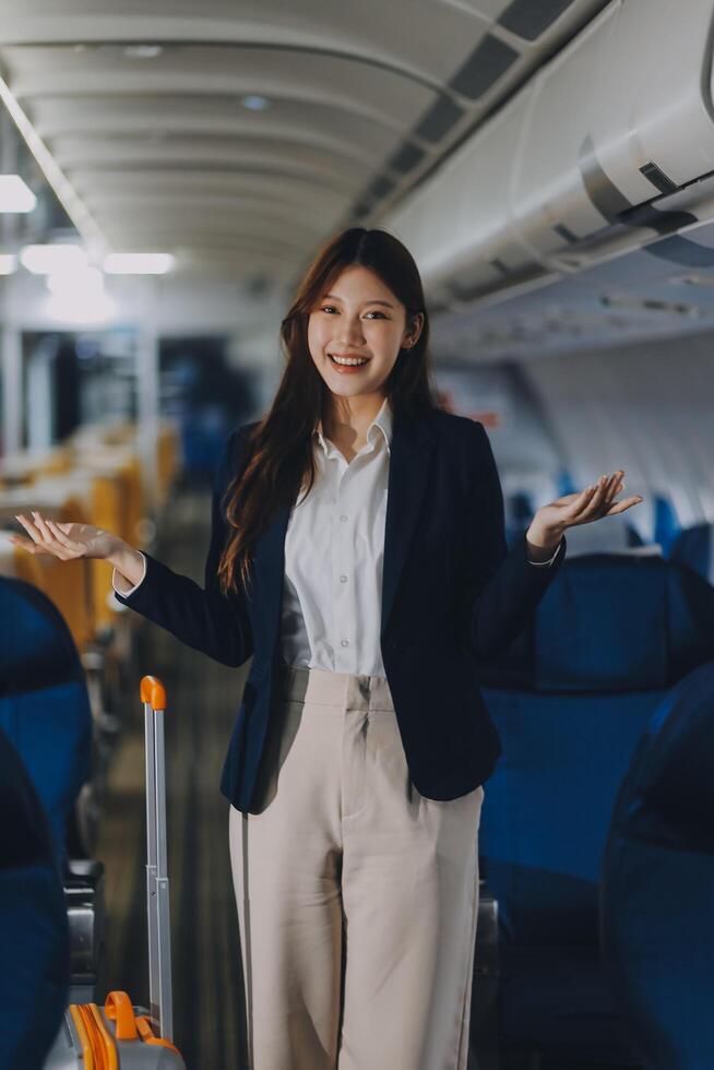 Asian young women passenger walk in airport terminal to boarding gate. Attractive beautiful female tourist friends feeling happy and excited to go travel abroad by airplane for holiday vacation trip. photo