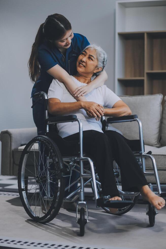 Asian physiotherapist helping elderly woman patient stretching arm during exercise correct with dumbbell in hand during training hand with patient Back problems in garden. Nursing home hospital photo