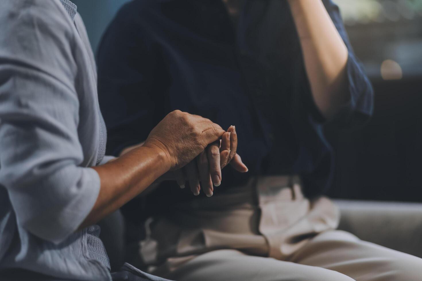 Sad teen granddaughter hugging depressed mature grandmother, giving support, help, comforting, consoling granny. Teenage daughter girl and middle aged mother going through family problems photo