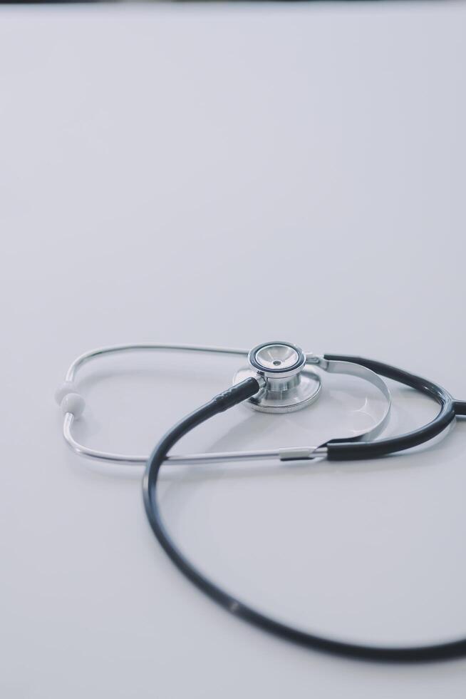 Health care billing statement with stethoscope, bottle of medicine for doctor's work in medical center stone background. photo