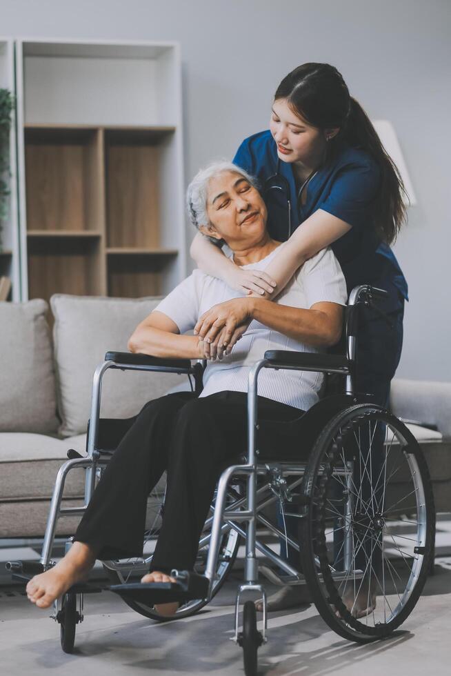 Asian physiotherapist helping elderly woman patient stretching arm during exercise correct with dumbbell in hand during training hand with patient Back problems in garden. Nursing home hospital photo
