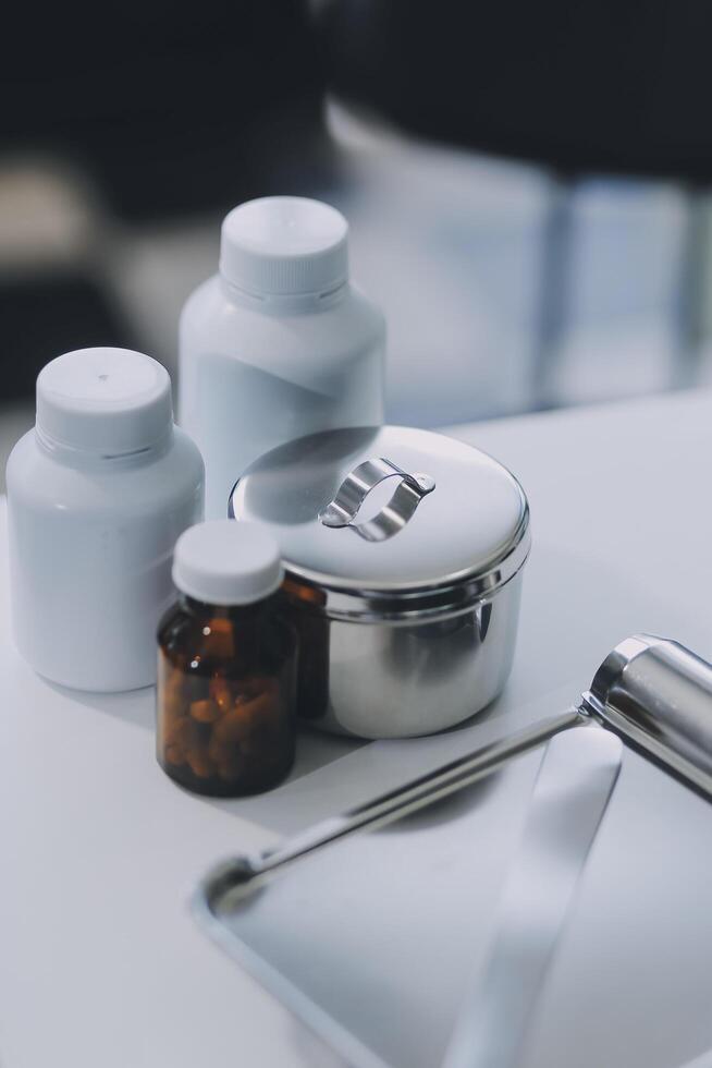 Health care billing statement with stethoscope, bottle of medicine for doctor's work in medical center stone background. photo