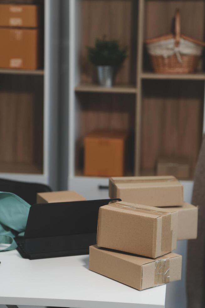 vlogger, blogger small SME business asian beautiful woman using mobile phone call for sell clothes live stream selling online, show product present detail at home office, entrepreneur ecommerce photo