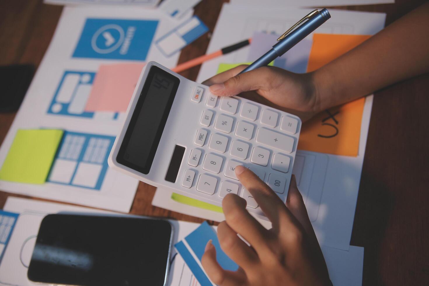 The designer team is designing the uxui system to make the uxui system work well on new phones and support system updates. Website development concept UI UX front end designer photo