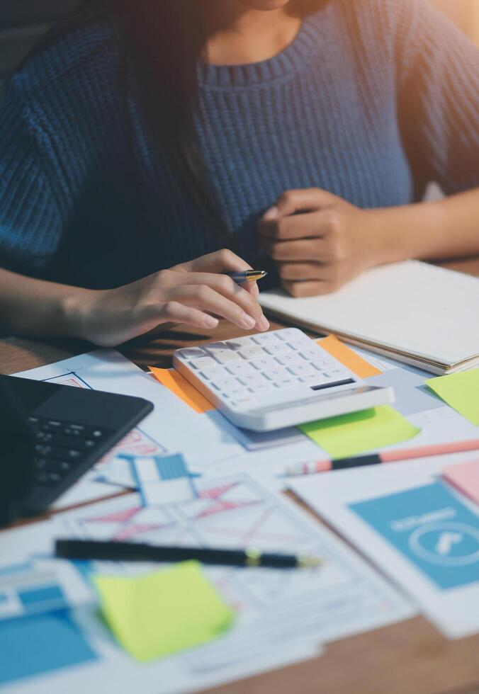 The designer team is designing the uxui system to make the uxui system work well on new phones and support system updates. Website development concept UI UX front end designer photo