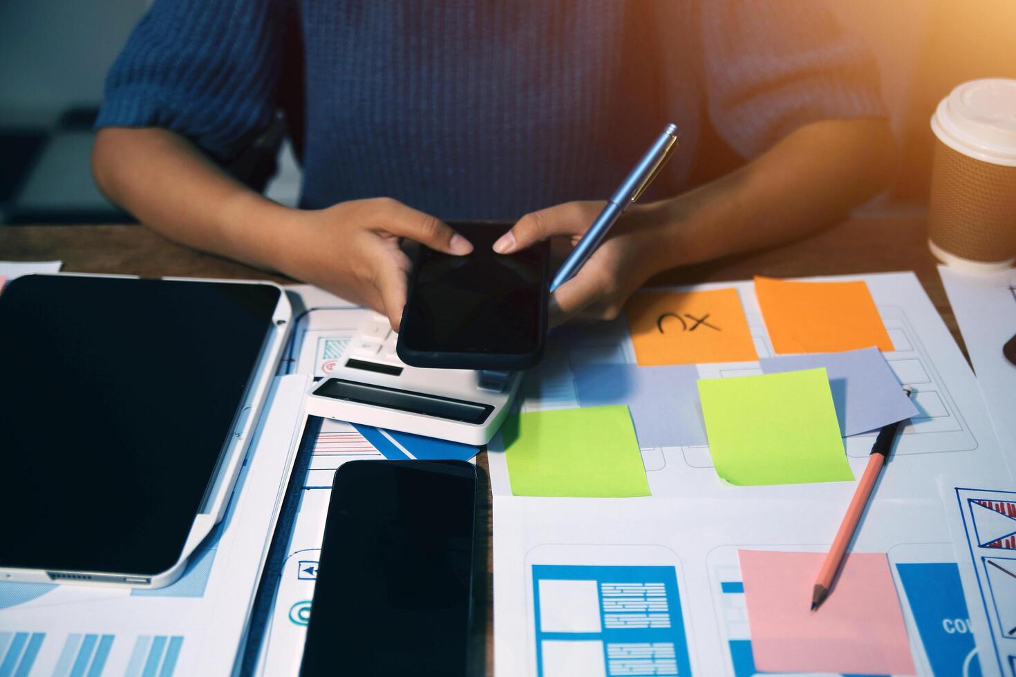The designer team is designing the uxui system to make the uxui system work well on new phones and support system updates. Website development concept UI UX front end designer photo