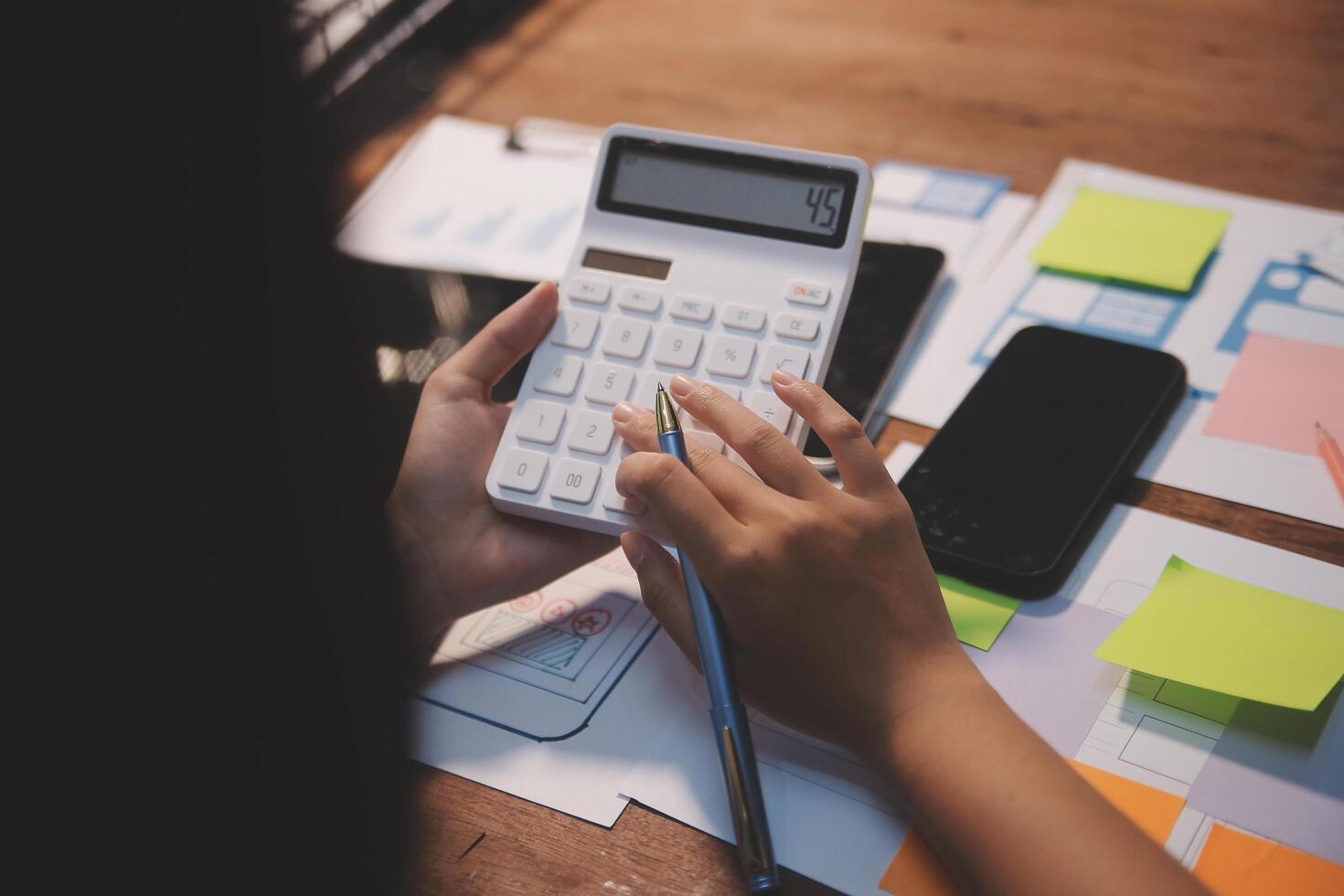The designer team is designing the uxui system to make the uxui system work well on new phones and support system updates. Website development concept UI UX front end designer photo